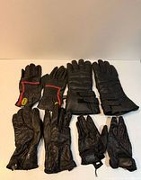 Overall view showing all five pairs of gloves front side