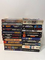 Two stacks of vintage science-fiction paperbacks showing overall lot