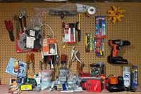 Wide view of pegboard with full assortment of tools and supplies