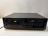 Front view of Yamaha K-1020 cassette deck showing display, controls and cassette well