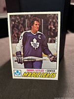 Front of Darryl Sittler O-Pee-Chee card showing image and Maple Leafs caption