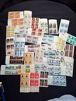 Overview of all 35 different U.S. plate blocks arranged on dark background