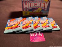 Five sealed 1991-92 O-Pee-Chee wax packs laid out in front of display box