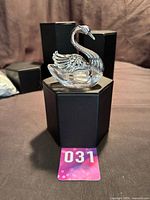 Front-side view of sterling silver and crystal swan salt cellar