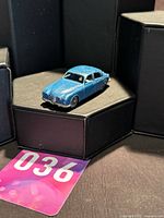 Front three-quarter view of blue Matchbox Jaguar diecast car