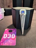 Full view of bookmark front, showing overall form and nickel finish