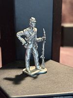 Front view of metal Union soldier figurine holding rifle