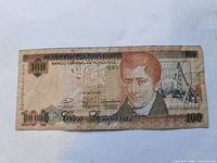 Obverse of Honduran 100 lempiras note with portrait, denomination, serial