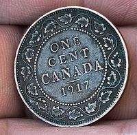 Reverse of 1917 Canadian one cent coin showing denomination, country and date