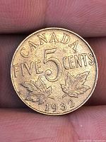 Reverse side showing CANADA FIVE CENTS 1932 and maple leaves
