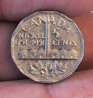 Reverse of 1951 Canada nickel showing Sudbury Mine design and denomination