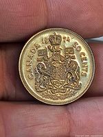 Reverse side showing Canadian Coat of Arms and denomination