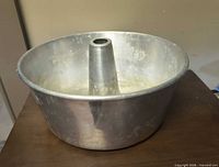 Aluminum tube cake pan angled top view showing interior and center cone