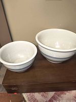 Both stoneware bowls side by side on wooden surface
