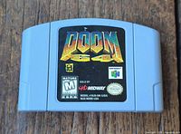 Front view of Doom 64 cartridge showing label details