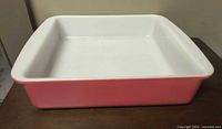 Side view of pink square Pyrex dish