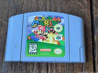 Front view of Super Mario 64 cartridge showing label and condition
