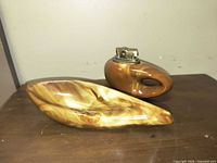 Ceramic lighter and matching dish side by side showing marbled glaze