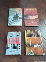 All four paperback books laid out showing front covers