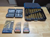 All six drill bit sets laid out on table