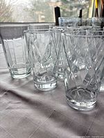 Group of assorted glasses showing two textured patterns and heights