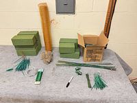 Group shot showing foam bricks, mesh roll, box of foam sections, picks, wires