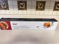 Box of Master Chef Universal Rotisserie Kit showing product image and branding