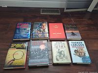 All eight hardcover books front covers visible