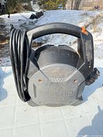 Front view of RIDGID blower showing logo, handle, cord wrap