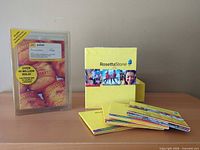 Clamshell package, slipcase, and booklets displayed on desk