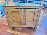 Front view closed showing doors, knobs and overall wear