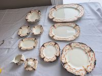 Entire dinnerware set laid out on table