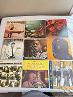 All nine album covers laid out in 3×3 grid showing front artwork and sleeve wear