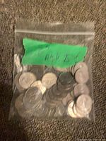 Front view of sealed bag containing assorted Canadian nickels
