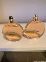 Front view of two nearly full Chanel Chance EDP bottles