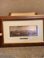Front view of framed silver artwork