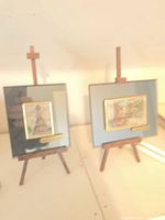 Both framed plaques on easels