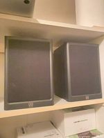 Front view of two Wharfedale Diamond IV bookshelf speakers with grilles