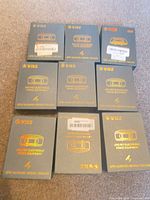 Nine boxed WIEZ GPS pet electronic fence receivers, top view