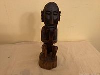 Front view of carved wooden Bulul figure