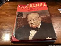 Front view of the hardcover book with torn dust jacket