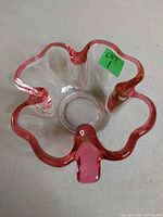 Top view showing cloverleaf shape and pink edged rim