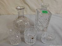 All five cut glass barware pieces grouped