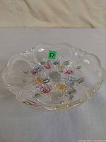 Top view showing scalloped rim and multicolored glass rose decorations