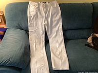 Front view of white Earl Jean size 12 jeans laid flat