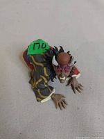 Top view of Hantengu statue displaying horns, facial features, robe pattern, overall condition