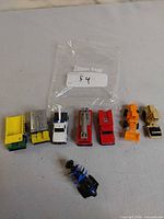 All eight toy vehicles grouped