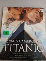 Front cover showing title and image of ship with actors