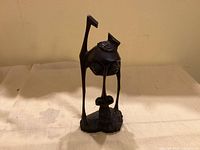 Full view of the Makonde Shetani spirit sculpture showing overall form and break at top