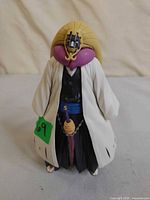 Front view of Mayuri Kurotsuchi figure showing attire, colors, and accessories